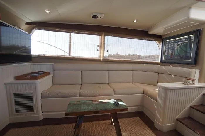 Slide: The Image of Luxurious interior of 2003 Huckins Atlantic 44 yacht with elegant seating and decor. - 25