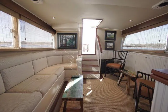 Slide: The Image of Luxurious interior of a 2003 Huckins Atlantic 44 yacht with elegant seating and decor. - 27