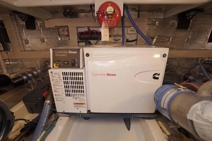 Slide: The Image of Cummins Onan generator in 2003 Huckins Atlantic 44 engine room. - 38