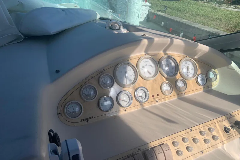 Slide: The Image of 1998 Cruisers 3375 Espirit dashboard with gauges and controls in sunlight. - 10