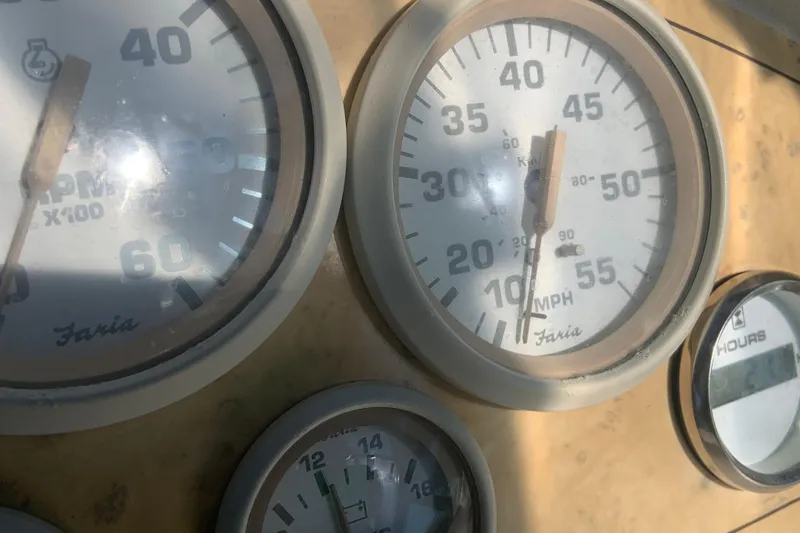 Slide: The Image of Close-up of 1998 Cruisers 3375 Espirit boat gauges, displaying speed and RPM. - 13