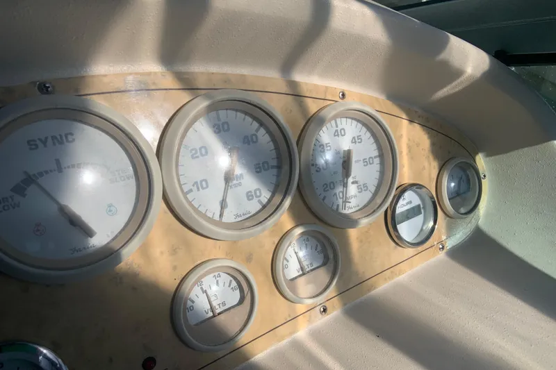 Slide: The Image of Dashboard of a 1998 Cruisers 3375 Espirit boat with various gauges. - 15