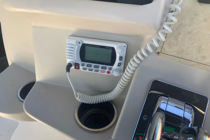 Slide: The Image of 1998 Cruisers 3375 Espirit boat dashboard with radio and controls. - 20