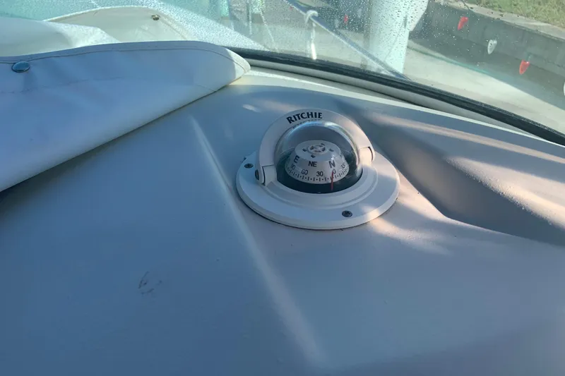 Slide: The Image of Compass on 1998 Cruisers 3375 Espirit boat dashboard, morning light. - 21