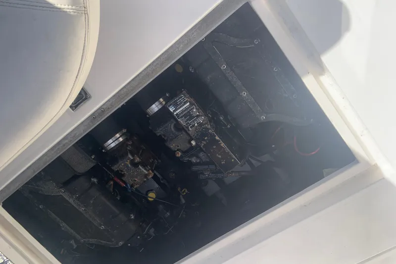 Slide: The Image of Engine compartment of a 1998 Cruisers 3375 Espirit boat, showing mechanical components. - 22