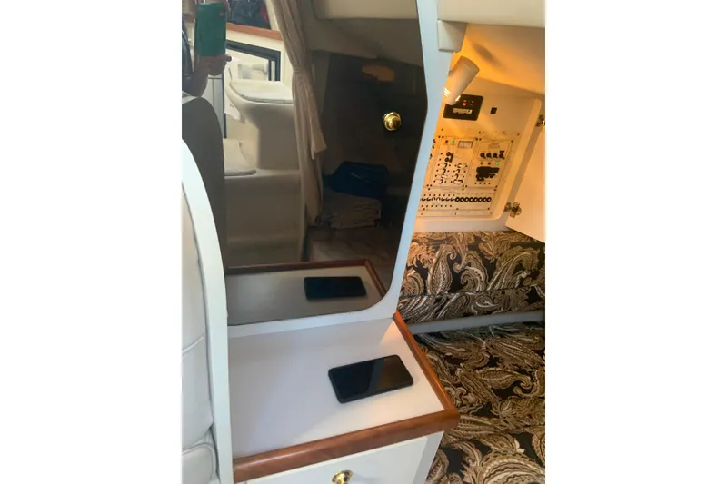 Slide: The Image of 1998 Cruisers 3375 Espirit cabin interior with control panel and patterned upholstery. - 25