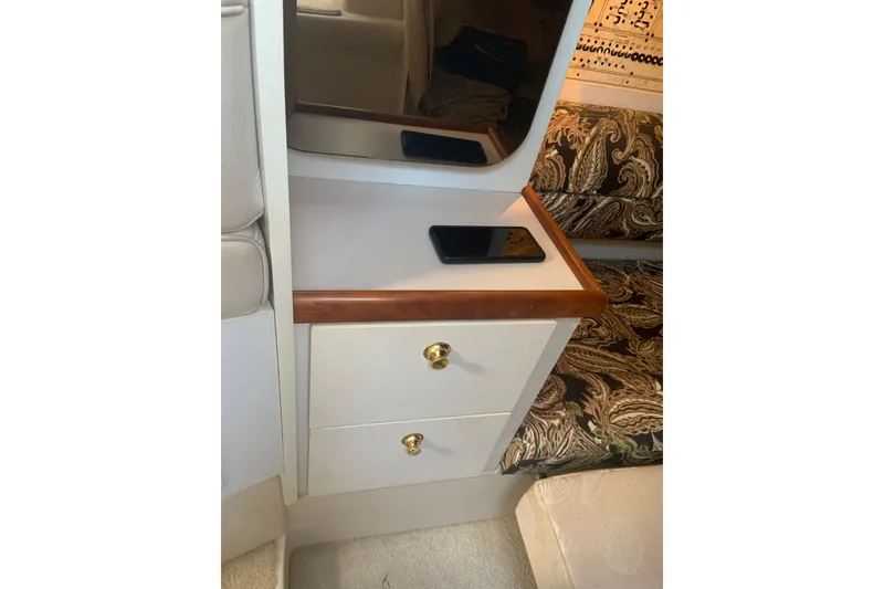 Slide: The Image of 1998 Cruisers 3375 Espirit cabin interior with drawers and patterned upholstery. - 26