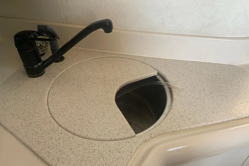 Slide: The Image of 1998 Cruisers 3375 Espirit boat sink with faucet and countertop cover. - 39