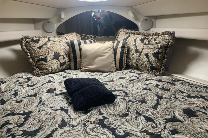 Slide: The Image of Luxurious cabin interior of 1998 Cruisers 3375 Espirit with patterned bedding and pillows. - 41