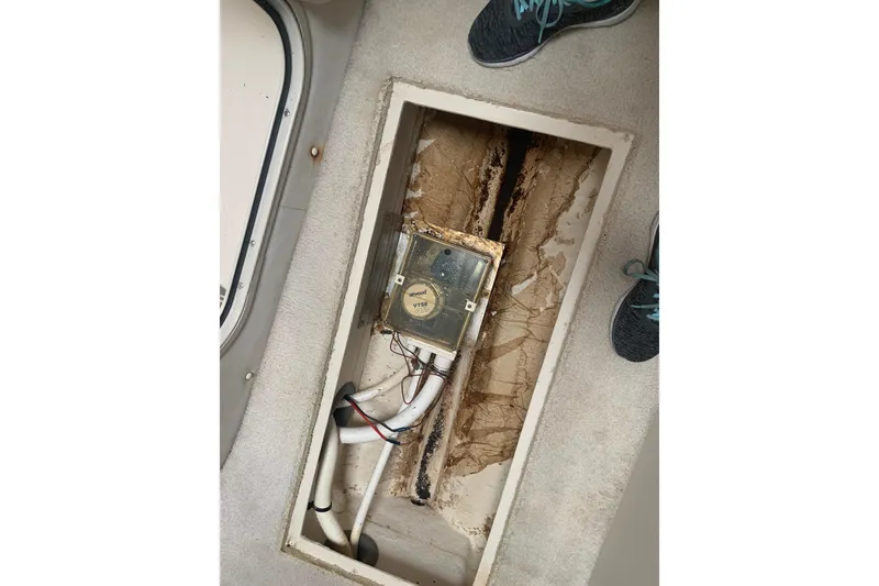 Slide: The Image of Open hatch in 1998 Cruisers 3375 Espirit boat showing wiring and components. - 45