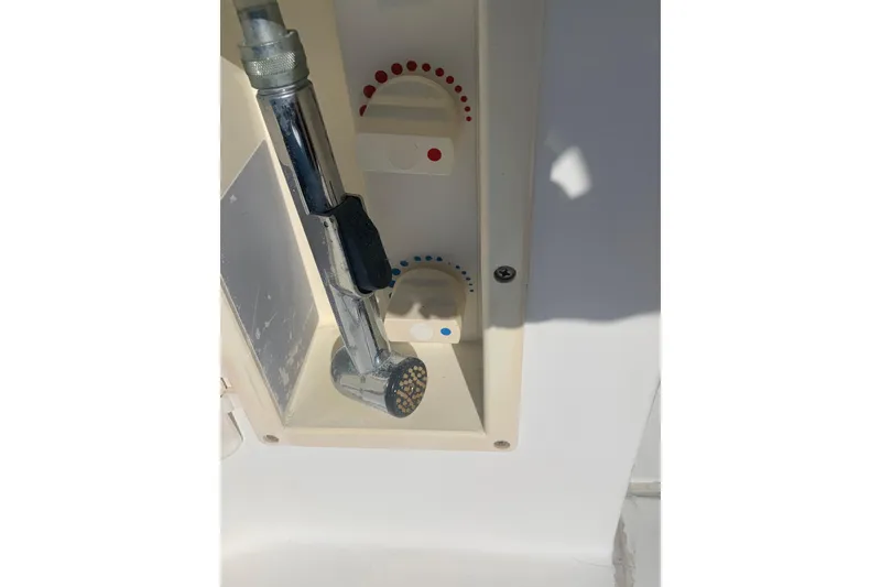 Slide: The Image of 1998 Cruisers 3375 Espirit boat shower controls with chrome handheld showerhead. - 48