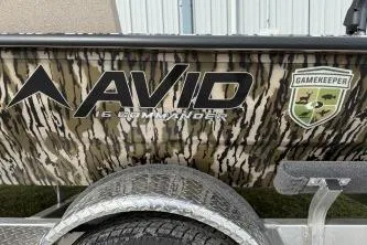 Slide: The Image of 2026 Avid 16 Commander boat with camouflage design and Gamekeeper logo. - 10