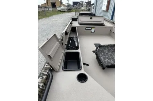 Slide: The Image of 2026 Avid 16 Commander boat interior with storage compartments and seating. - 5