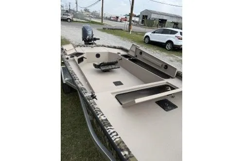 Slide: The Image of 2026 Avid 16 Commander boat with open deck and storage compartments. - 6