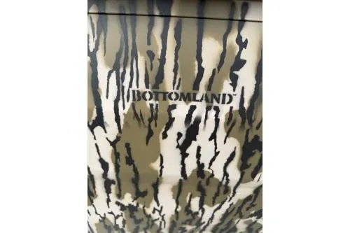 Slide: The Image of Camouflage pattern on 2026 Avid 16 Commander with "Bottomland" text. - 9