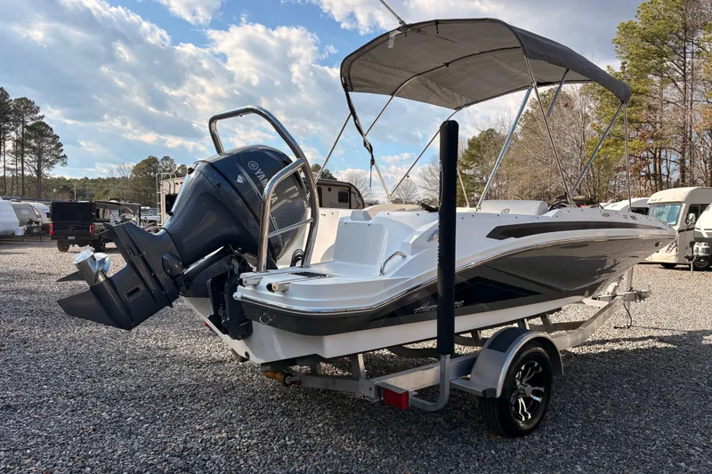 Slide: The Image of 2022 Hurricane SunDeck Sport 185 OB boat with outboard motor on trailer. - 4
