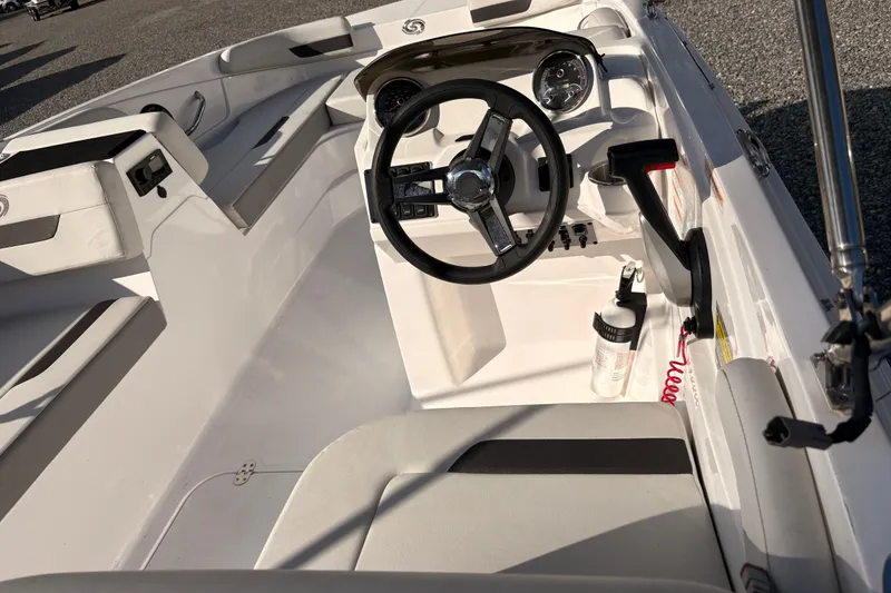 Slide: The Image of 2022 Hurricane SunDeck Sport 185 OB boat interior with steering wheel and seating. - 7