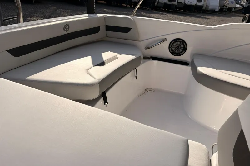 Slide: The Image of 2022 Hurricane SunDeck Sport 185 OB interior with cushioned seating and speaker. - 8