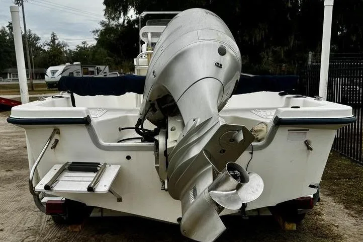 Slide: The Image of 2003 Sea Fox 215 Bay Fisher boat with outboard motor, rear view. - 3