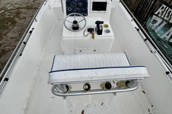 Slide: The Image of 2003 Sea Fox 215 Bay Fisher boat interior with steering console and seating. - 6