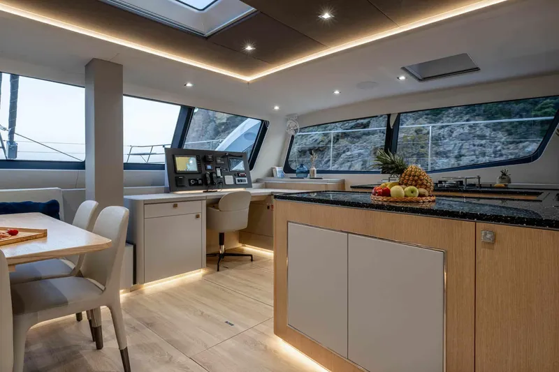 Slide: The Image of Luxurious interior of 2025 Privilege Signature 580 yacht with modern kitchen and dining area. - 30
