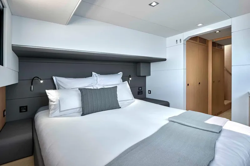 Slide: The Image of Luxurious bedroom interior of 2025 Privilege Signature 580 yacht, featuring modern design and cozy bedding. - 49