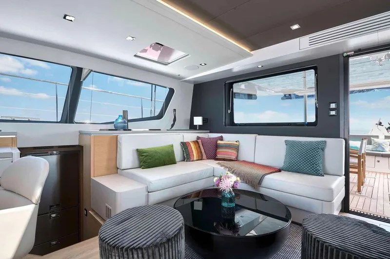Slide: The Image of Luxurious interior of 2025 Privilege Signature 580 yacht with modern seating and ocean view. - 44