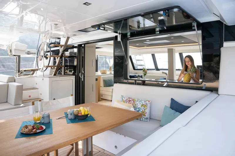 Slide: The Image of Luxurious interior of 2025 Privilege Signature 580 yacht with dining area and modern decor. - 26
