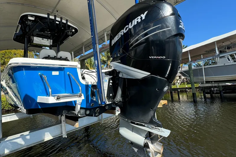 Slide: The Image of 2019 Sea Pro 248 Bay boat with Mercury Verado engine on lift. - 15
