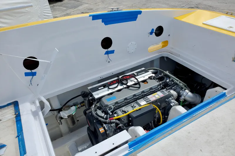 Slide: The Image of 2005 Thriller Powerboats Super Cat 55 engine compartment, showcasing detailed mechanical components. - 19