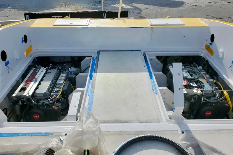 Slide: The Image of 2005 Thriller Powerboats Super Cat 55 engine compartment with dual engines visible. - 21