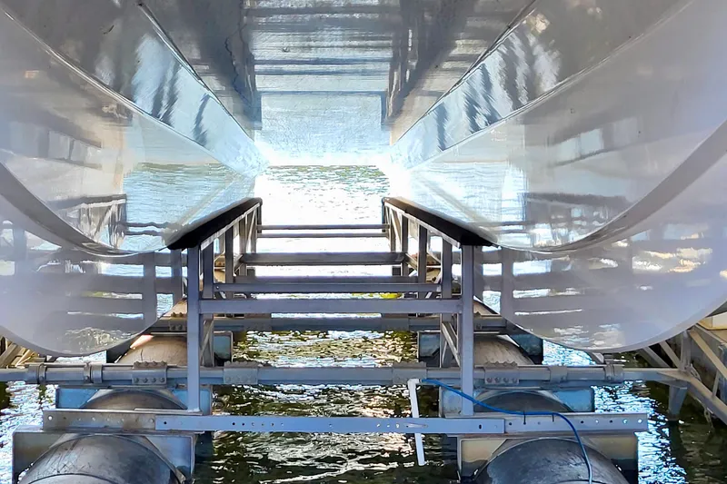 Slide: The Image of Underneath view of a 2005 Thriller Powerboats Super Cat 55 on a lift. - 27