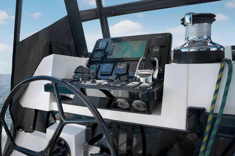 Slide: The Image of Helm of 2025 Privilege Signature 580 yacht with advanced navigation controls. - 15