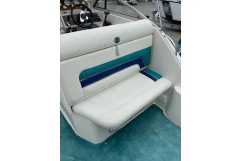 Slide: The Image of 1996 Donzi 275 LXC boat interior with white and blue seating. - 10