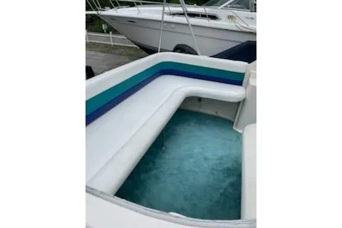 Slide: The Image of 1996 Donzi 275 LXC boat interior with white and blue seating. - 5