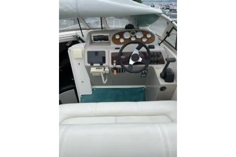 Slide: The Image of 1996 Donzi 275 LXC boat cockpit with steering wheel and control panel. - 6