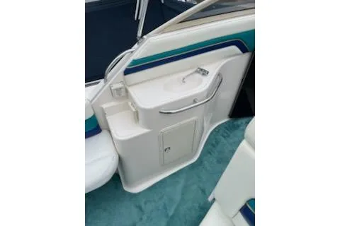 Slide: The Image of 1996 Donzi 275 LXC boat interior with sink and storage compartment. - 7