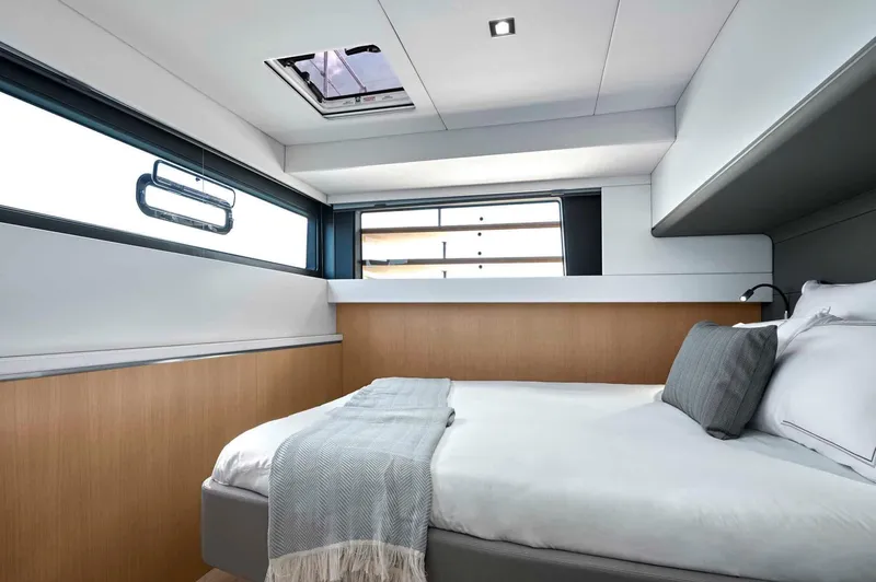 Slide: The Image of Luxurious cabin interior of 2025 Privilege Signature 580 yacht, featuring modern design and cozy bedding. - 48