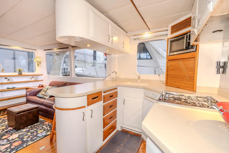 Slide: The Image of Interior of 1973 American Marine Alaskan 53 yacht with modern kitchen and cozy seating area. - 17