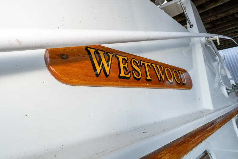 Slide: The Image of 1973 American Marine Alaskan 53 boat with "Westwood" nameplate on wooden plaque. - 2