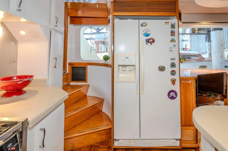 Slide: The Image of Interior of 1973 American Marine Alaskan 53 yacht with kitchen and staircase. - 20