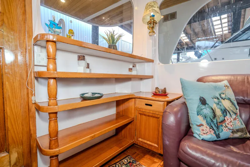 Slide: The Image of Interior of 1973 American Marine Alaskan 53 with wooden shelves and decorative elements. - 23