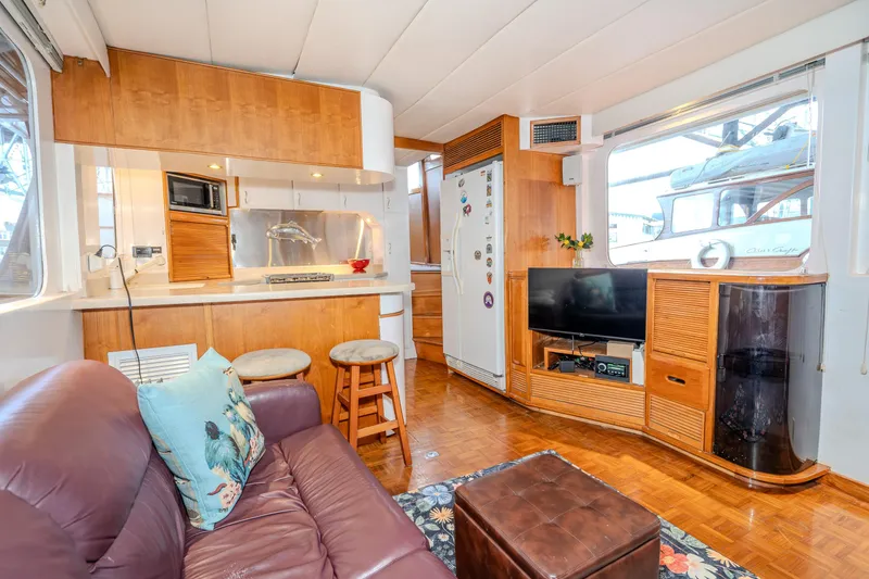 Slide: The Image of Interior of 1973 American Marine Alaskan 53 yacht with cozy seating and modern amenities. - 24