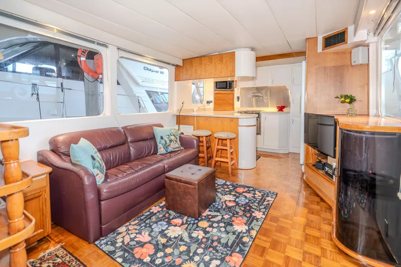 Slide: The Image of Interior of 1973 American Marine Alaskan 53 yacht with cozy living area and kitchen. - 25