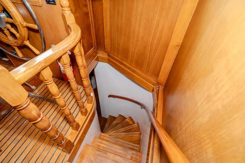 Slide: The Image of Wooden staircase and helm inside a 1973 American Marine Alaskan 53 yacht. - 26