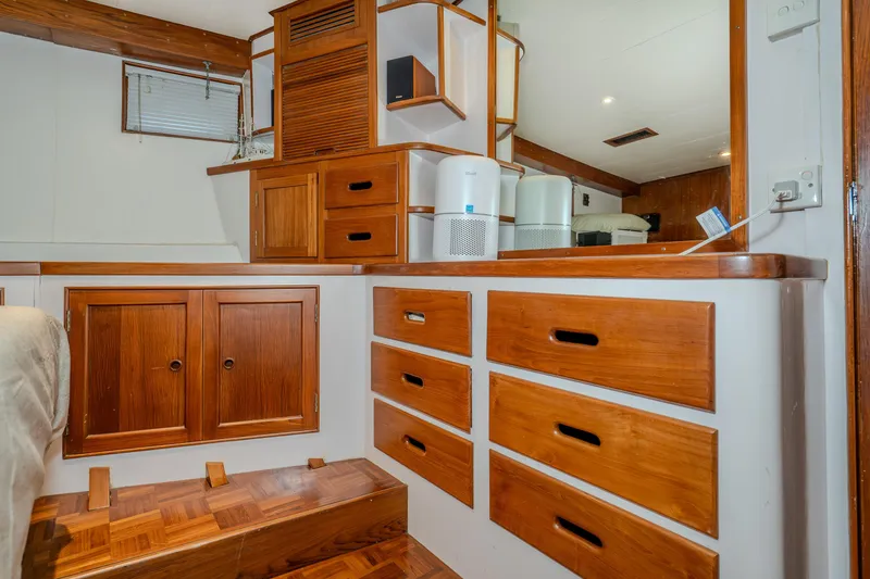 Slide: The Image of Interior of 1973 American Marine Alaskan 53 yacht with wooden cabinetry and modern appliances. - 33