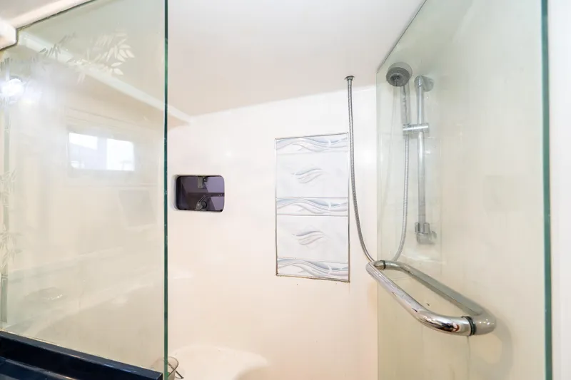 Slide: The Image of Shower area in 1973 American Marine Alaskan 53 yacht with glass door and modern fixtures. - 36