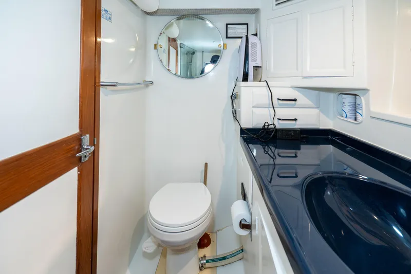 Slide: The Image of Bathroom interior of 1973 American Marine Alaskan 53 yacht, featuring modern amenities and sleek design. - 38