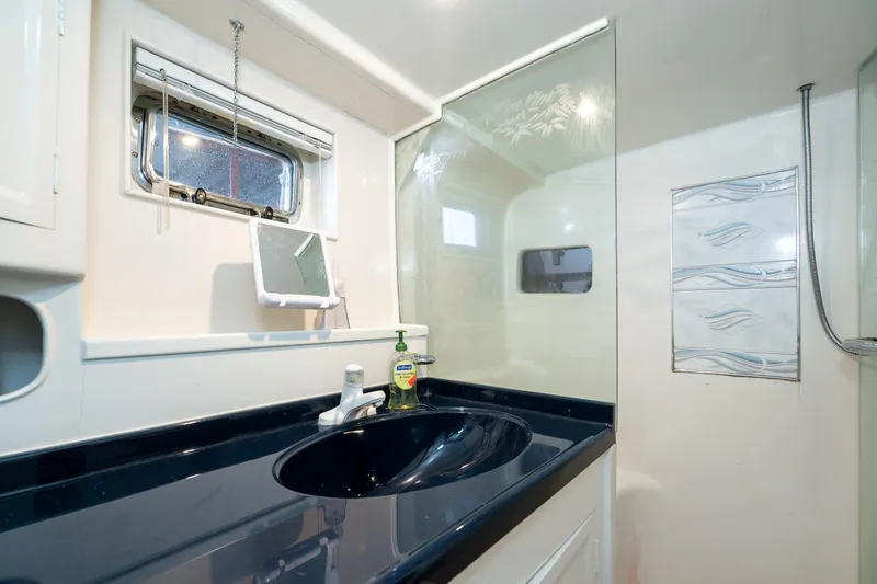 Slide: The Image of Bathroom interior of 1973 American Marine Alaskan 53 yacht with modern sink and shower. - 39