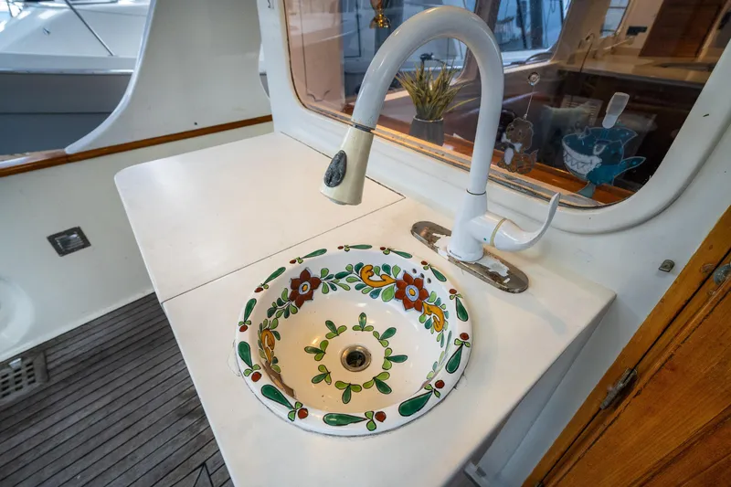 Slide: The Image of Decorative sink on 1973 American Marine Alaskan 53 yacht with floral design. - 43